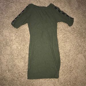 Green dress with black cross crossing